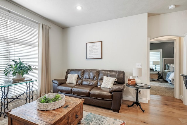 1086 S Joshua Ave, Republic, MO 65738 - living area with light wood-style flooring, arched walkways, baseboards, and recessed lighting