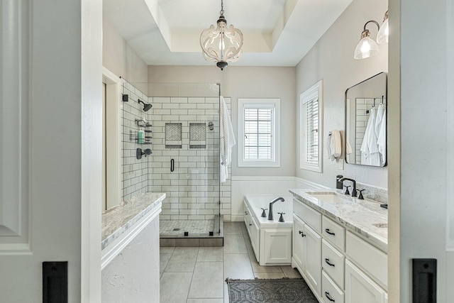 1086 S Joshua Ave, Republic, MO 65738 - full bath featuring a chandelier, a shower stall, a garden tub, tile patterned floors, and vanity