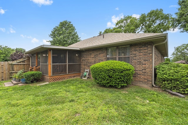 650 S Woodbridge Ct, Nixa, MO 65714 - back of house featuring a sunroom, brick siding, and roof with shingles