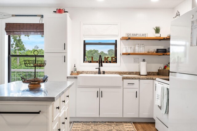96 Samson St, Cape Fair, MO 65624 - kitchen with freestanding refrigerator, a sink, range, white cabinetry, and recessed lighting