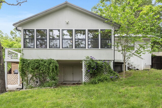 96 Samson St, Cape Fair, MO 65624 - rear view of house with a lawn and a sunroom