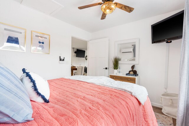 96 Samson St, Cape Fair, MO 65624 - bedroom featuring an AC wall unit, attic access, baseboards, and a ceiling fan