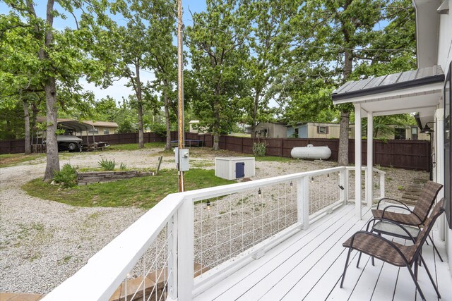 96 Samson St, Cape Fair, MO 65624 - wooden terrace featuring a detached carport and a fenced backyard