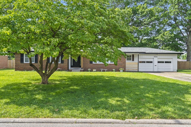 1514 W Swan St, Springfield, MO 65807 - view of front of home featuring a garage, driveway, entry steps, and brick siding