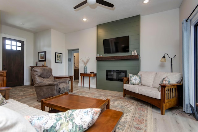 1503 W Ragweed Ct, Ozark, MO 65721 - living area with wood finished floors, a ceiling fan, a fireplace, and recessed lighting