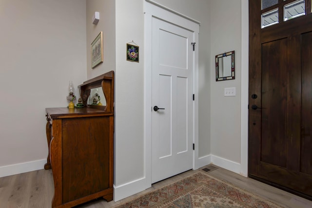 1503 W Ragweed Ct, Ozark, MO 65721 - entryway featuring baseboards and wood finished floors