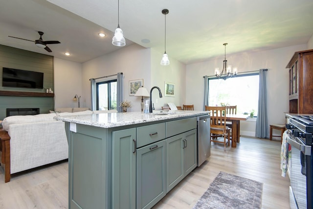 1503 W Ragweed Ct, Ozark, MO 65721 - kitchen featuring a sink, stainless steel appliances, open floor plan, light wood-type flooring, and recessed lighting