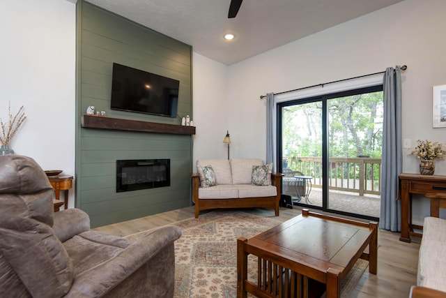 1503 W Ragweed Ct, Ozark, MO 65721 - living area featuring wood finished floors, a fireplace, ceiling fan, and recessed lighting