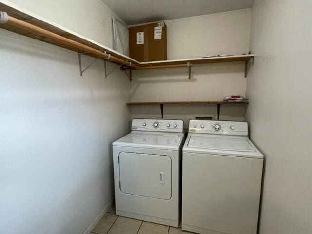 607 Robin Rd, Mountain Grove, MO 65711 - laundry room featuring separate washer and dryer, light tile patterned floors, and baseboards