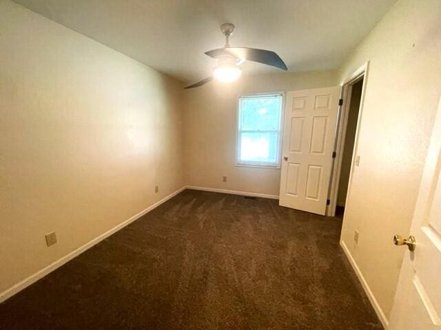 607 Robin Rd, Mountain Grove, MO 65711 - spare room with ceiling fan, carpet floors, and baseboards