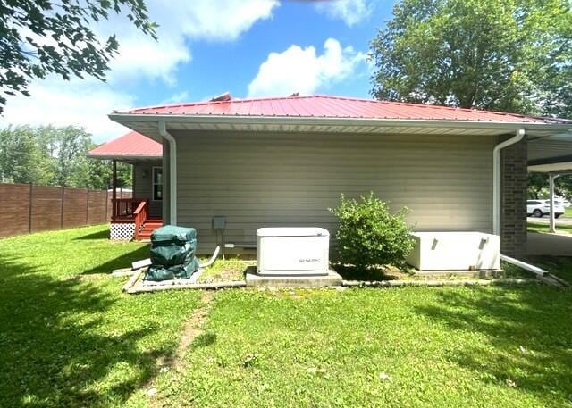 607 Robin Rd, Mountain Grove, MO 65711 - rear view of house with metal roof