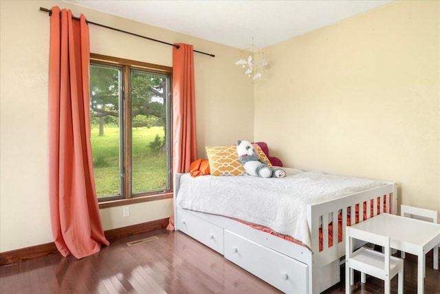 898 Short State Highway Y, Marshfield, MO 65706 - bedroom featuring baseboards, wood finished floors, and a chandelier
