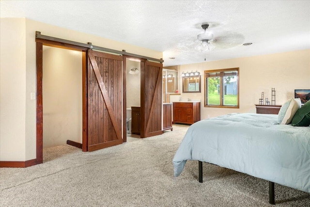 898 Short State Highway Y, Marshfield, MO 65706 - bedroom featuring a barn door, light colored carpet, a textured ceiling, baseboards, and ceiling fan