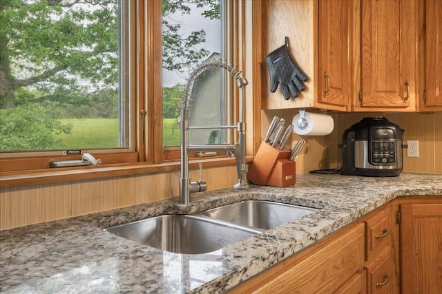 898 Short State Highway Y, Marshfield, MO 65706 - kitchen featuring a sink, brown cabinets, light stone counters, and decorative backsplash
