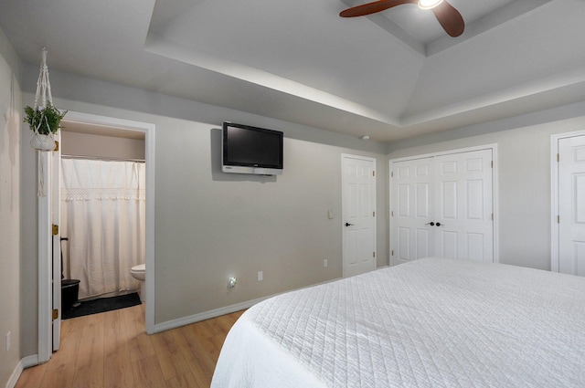 505 Thunderbird Dr, Rogersville, MO 65742 - bedroom with light wood finished floors, a raised ceiling, baseboards, and ensuite bathroom