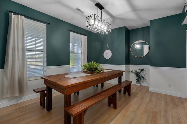 505 Thunderbird Dr, Rogersville, MO 65742 - dining room featuring a chandelier, light wood-style flooring, and baseboards