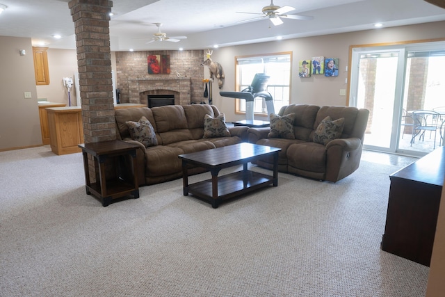 711 Morning Glory Dr, Nixa, MO 65714 - living room featuring decorative columns, a ceiling fan, light colored carpet, healthy amount of natural light, and recessed lighting