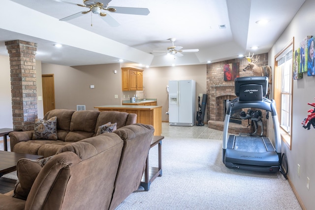 711 Morning Glory Dr, Nixa, MO 65714 - living area with ceiling fan, decorative columns, recessed lighting, a tray ceiling, and light colored carpet