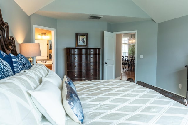 711 Morning Glory Dr, Nixa, MO 65714 - bedroom with lofted ceiling, baseboards, and connected bathroom