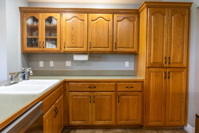 711 Morning Glory Dr, Nixa, MO 65714 - kitchen with dishwasher, a sink, glass insert cabinets, and brown cabinetry