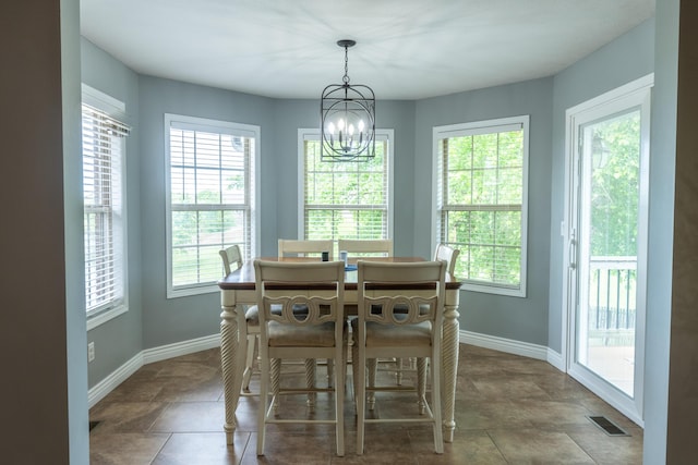 711 Morning Glory Dr, Nixa, MO 65714 - dining space featuring healthy amount of natural light, a chandelier, and baseboards