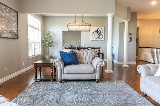 711 Morning Glory Dr, Nixa, MO 65714 - living room featuring decorative columns, wood finished floors, and baseboards