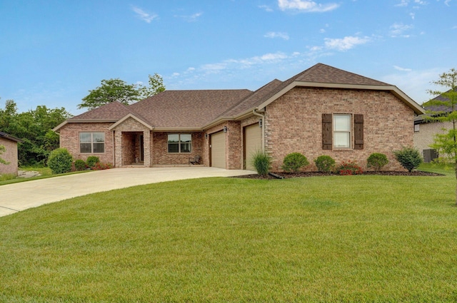 1002 E Tipperary Ct, Nixa, MO 65714 - view of front facade featuring concrete driveway, an attached garage, a front yard, brick siding, and a shingled roof