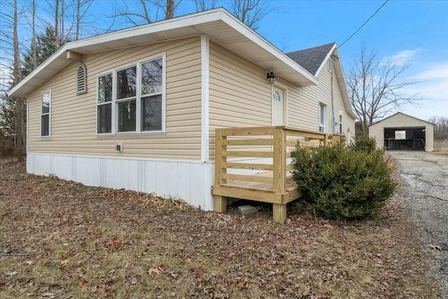 2845 US Highway 65, Urbana, MO 65767 - view of side of property with an outbuilding and a garage