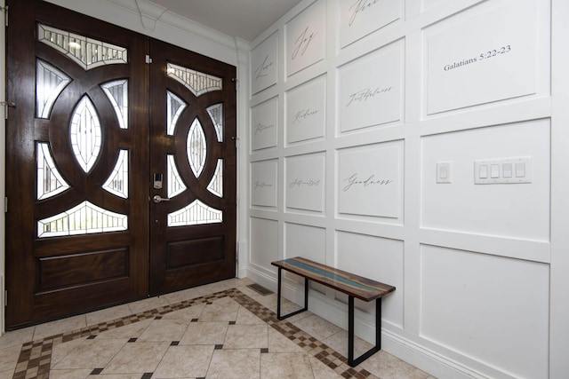 992 N Cedar Ridge Ave, Springfield, MO 65802 - entrance foyer with a decorative wall, light tile patterned floors, and inlaid floor details