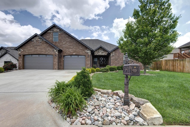 992 N Cedar Ridge Ave, Springfield, MO 65802 - view of front facade featuring driveway, a garage, and brick siding
