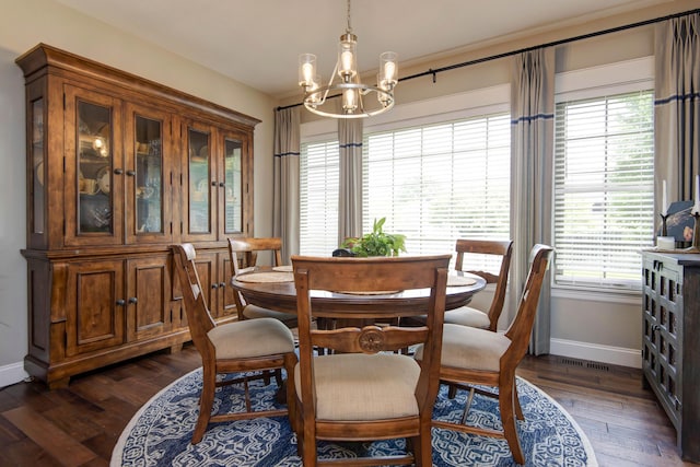 992 N Cedar Ridge Ave, Springfield, MO 65802 - dining area with baseboards, a chandelier, and dark wood-style flooring