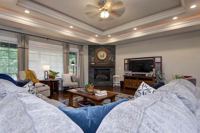 992 N Cedar Ridge Ave, Springfield, MO 65802 - living room with ornamental molding, a raised ceiling, wood finished floors, a ceiling fan, and a fireplace