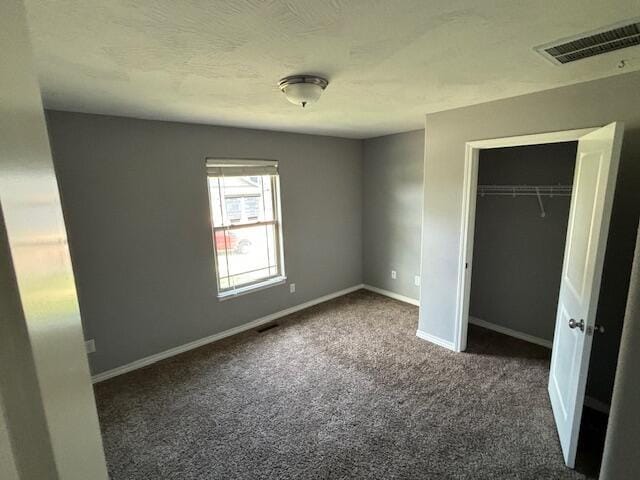1015 E Lakota St, Nixa, MO 65714 - unfurnished bedroom with carpet flooring, baseboards, and a closet