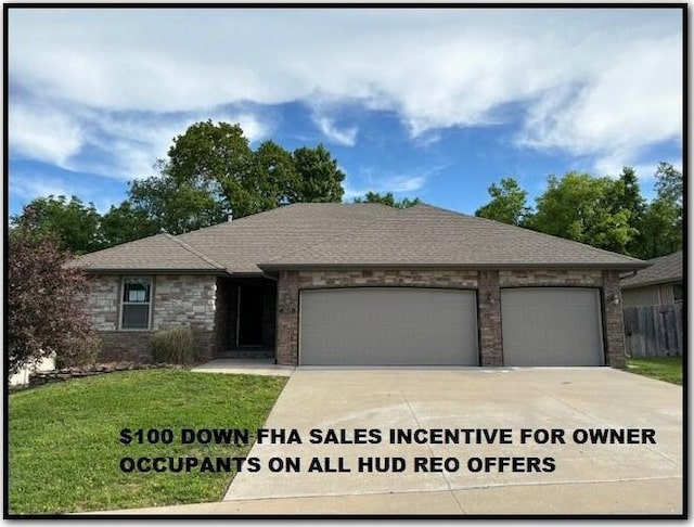 1015 E Lakota St, Nixa, MO 65714 - view of front of home featuring an attached garage, concrete driveway, a shingled roof, and brick siding