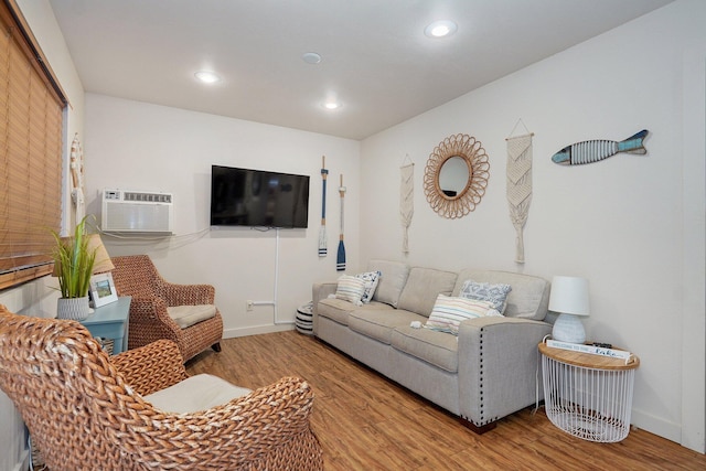4656 W State Highway H Unit 3, Lampe, MO 65681 - living room with a wall unit AC, wood finished floors, recessed lighting, and baseboards
