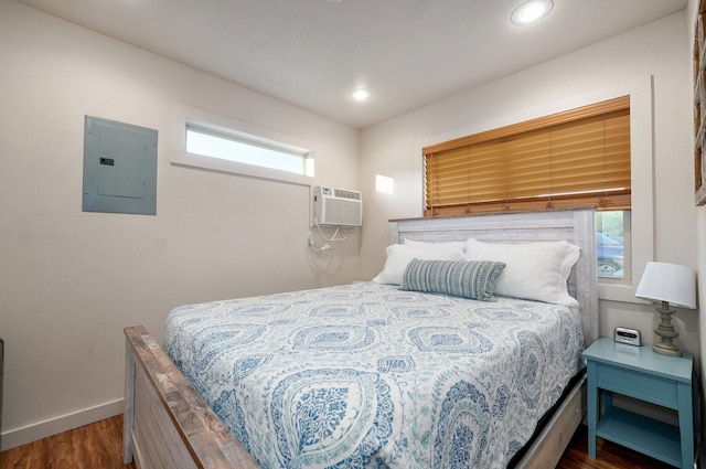 4656 W State Highway H Unit 3, Lampe, MO 65681 - bedroom with electric panel, wood finished floors, baseboards, recessed lighting, and a wall mounted AC