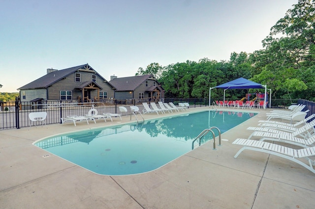 4656 W State Highway H Unit 3, Lampe, MO 65681 - community pool featuring a patio