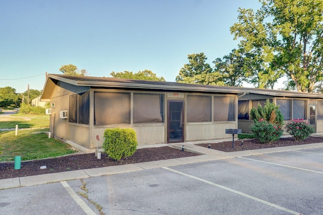 4656 W State Highway H Unit 3, Lampe, MO 65681 - view of front of property featuring a sunroom, uncovered parking, and a front yard