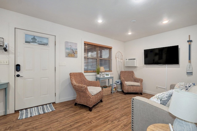 4656 W State Highway H Unit 3, Lampe, MO 65681 - living area with wood finished floors, baseboards, recessed lighting, and a wall mounted AC