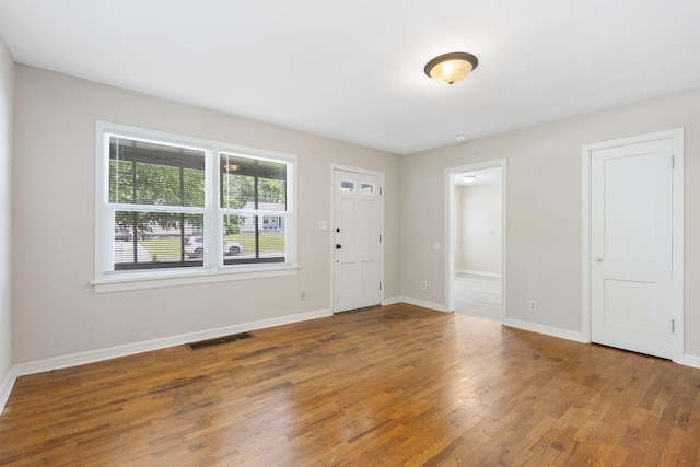 1116 W University St, Springfield, MO 65807 - foyer entrance with wood finished floors and baseboards