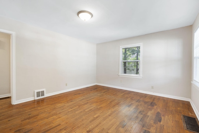1116 W University St, Springfield, MO 65807 - unfurnished room with hardwood / wood-style floors and baseboards