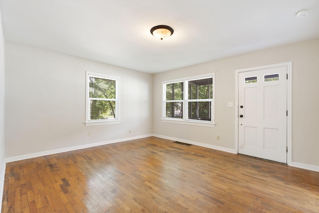 1116 W University St, Springfield, MO 65807 - entrance foyer featuring healthy amount of natural light, hardwood / wood-style floors, and baseboards