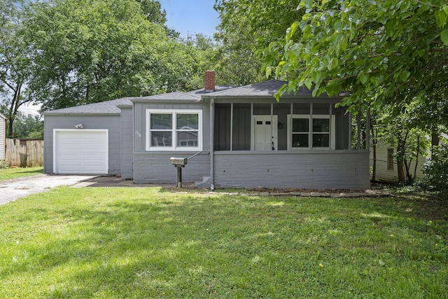 1116 W University St, Springfield, MO 65807 - ranch-style home featuring brick siding, concrete driveway, a chimney, an attached garage, and board and batten siding
