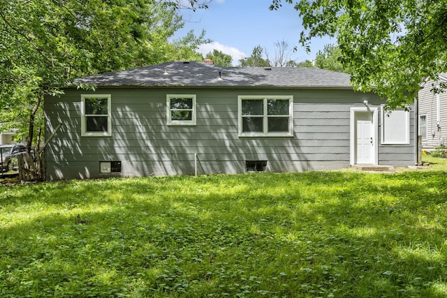 1116 W University St, Springfield, MO 65807 - back of property with a yard, a chimney, and a shingled roof
