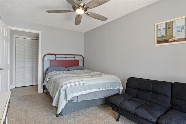 783 Winn Rd Unit 5B, Osage Beach, MO 65065 - carpeted bedroom featuring tile patterned floors and ceiling fan