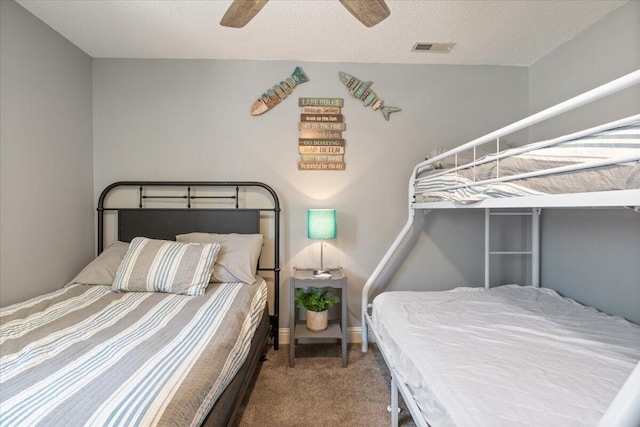 783 Winn Rd Unit 5B, Osage Beach, MO 65065 - carpeted bedroom featuring ceiling fan, baseboards, and a textured ceiling