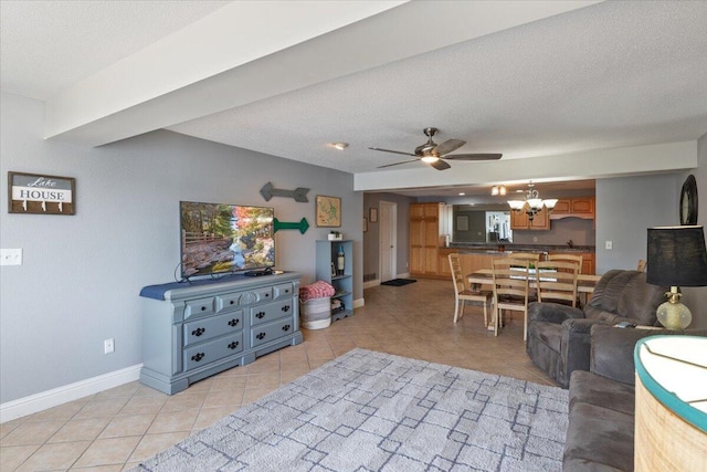 783 Winn Rd Unit 5B, Osage Beach, MO 65065 - living room featuring a chandelier, baseboards, light tile patterned floors, a ceiling fan, and a textured ceiling