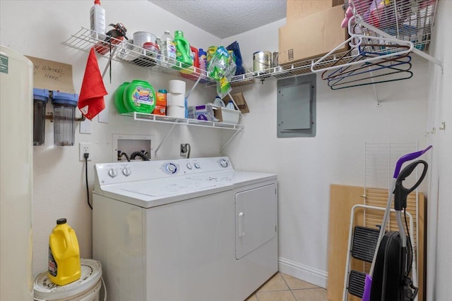 783 Winn Rd Unit 5B, Osage Beach, MO 65065 - laundry area with electric panel, washer and clothes dryer, and light tile patterned flooring