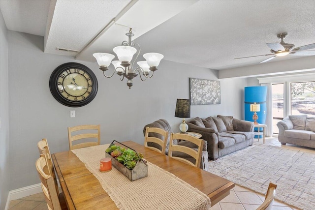 783 Winn Rd Unit 5B, Osage Beach, MO 65065 - dining area with light tile patterned floors, a chandelier, a ceiling fan, a textured ceiling, and baseboards
