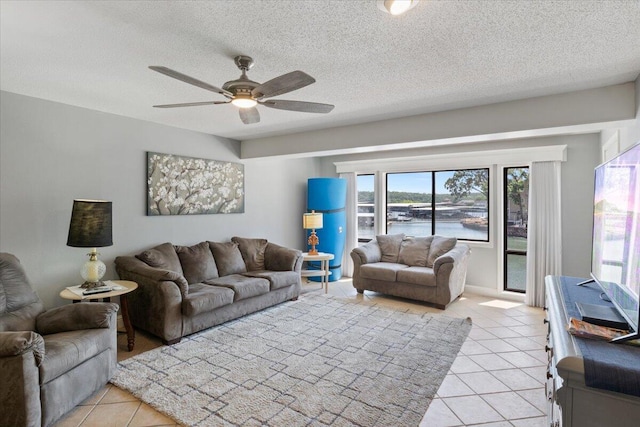 783 Winn Rd Unit 5B, Osage Beach, MO 65065 - living area with light tile patterned floors, a ceiling fan, and a textured ceiling
